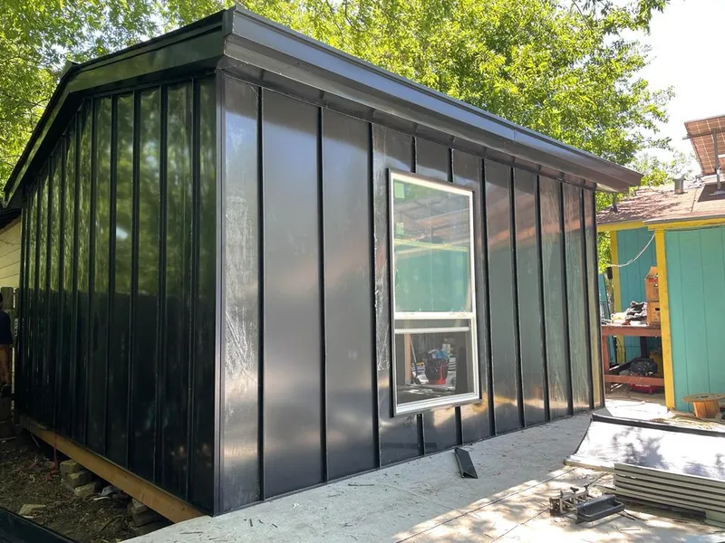 Black standing seam metal wall panels for Roof Inspection in Stockbridge